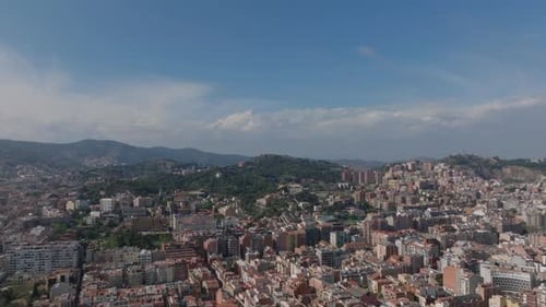 Forwards Fly Above Residential Urban Borough in Hilly Landscape Dense Town Development in Metropolis