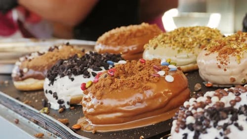 Sweet Donuts with Chocolate and Marshmallow Decoration on Top Closeup Street Fast Food Concept