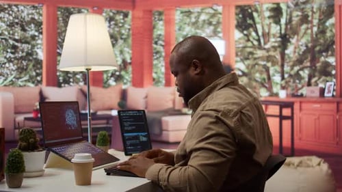 Software Engineer Coding on a Laptop Focusing on Deep Learning