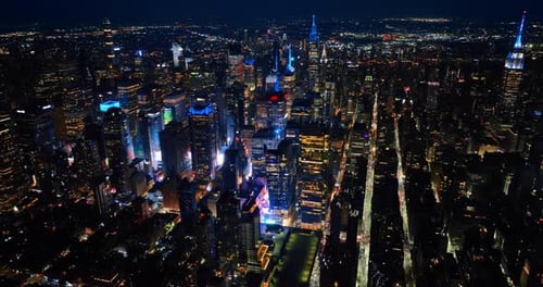 Cityscape sparkling with billions of lights. Majestic New York panorama at night. Aerial perspective
