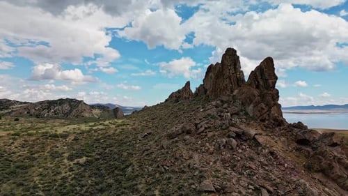 Aerial view flying over jagged rocks rocks along Flaming Gorge