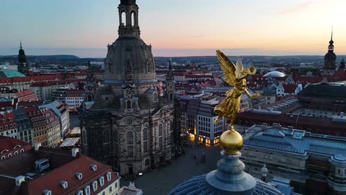 Drone shot of golden statue on top of the Academy of Fine Arts, Dresden, Germany