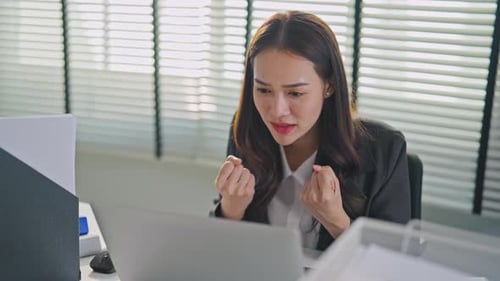Asian beautiful businesswoman using laptop computer working in office.