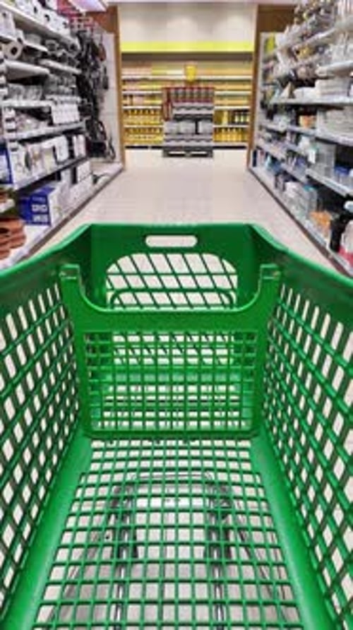POV shopping cart moving through supermarket aisles