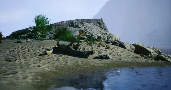 Serene Lakeside Landscape with Rocks and Greenery on a Clear Day ...