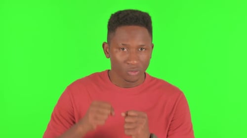 Fighting African Man Boxing on Green Background, Portrait