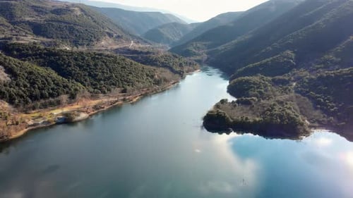 drone video over mountain lake at sunrise
