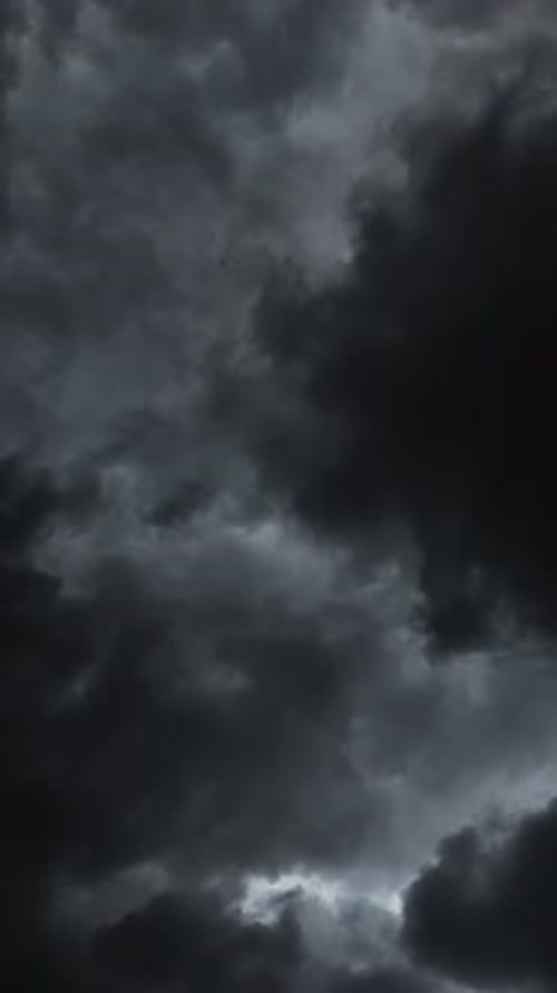Dark stormy rain cloud formations move quickly overhead TIMELAPSE