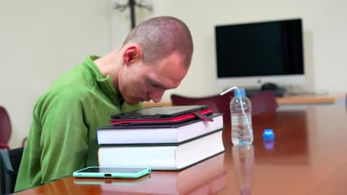 Man with Disability Sitting in Wheelchair in the University