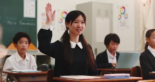 Students Raising Hand in Japanese Classroom