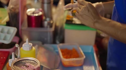 Two Unrecognizable People Working at Food Market in Chiang Mai Preparing Sushi