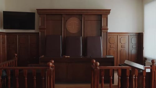 Judges Bench with Three Leather Chairs in Courtroom
