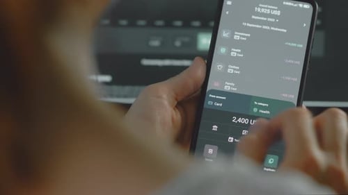 Hands Using Mobile Phone Finance and Expense App