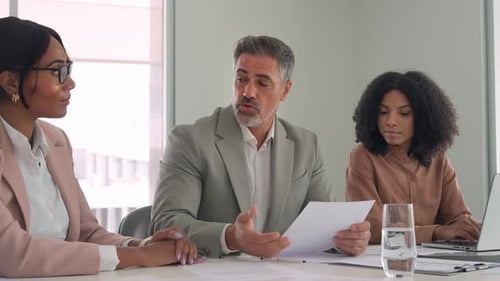 Corporate Team Discussing Business Strategy in Modern Office