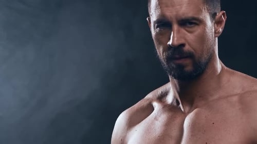Fit and Sporty Bodybuilder Over Black Background Bodybuilder Training Using Barbell The Concept of