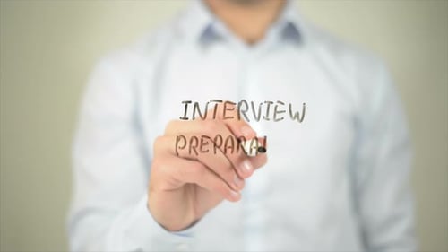 Interview Preparation Man Writing on Transparent Screen