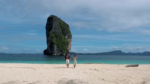 Koh Poda Krabi Thailand Asian Woman and European Men Walking on the Tropical Beach of Koh Poda