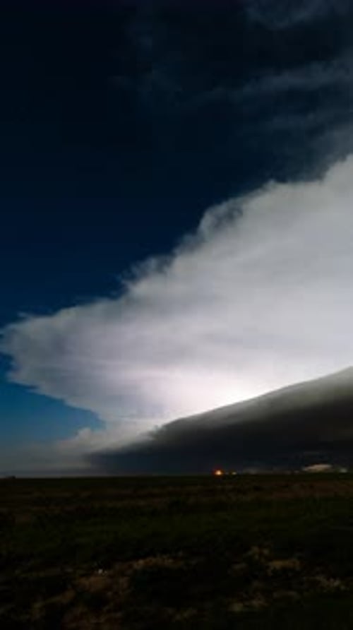 Dramatic Lightning Storm at Night Over Rural Landscape