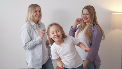 Cheerful Family Dancing Together in Home Interior