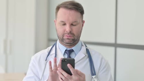 Doctor Using Smartphone in Hospital Close-Up