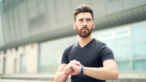 Man Using Smart Watch Fitness Tracker Outdoors
