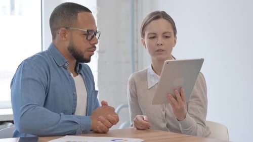 Multi Ethnic Casual People Working on Tablet in Office