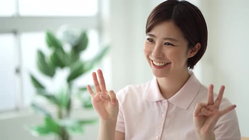 Smiling Woman Counting from One to Ten