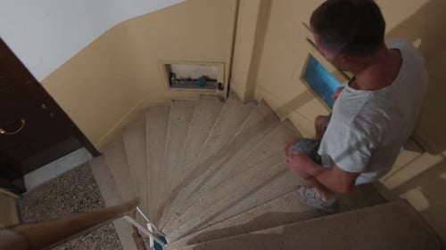 Man Runs Down on Stairs Inside the Old Residential Building Young Man Runs Down the Stairs