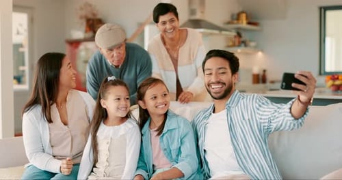 Happy Multi-Generational Family Taking a Selfie at Home