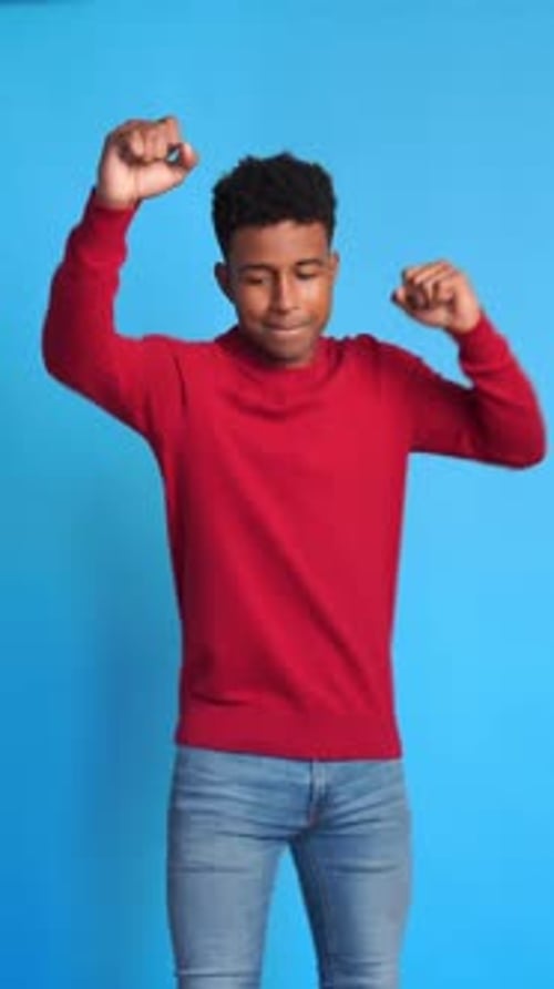 Cheerful Black Man Celebrating and Dancing