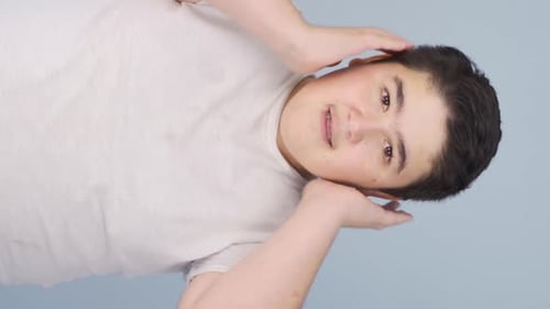 Young Adult Posing and Smiling in Studio
