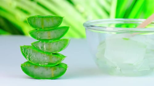 Fresh Aloe Vera Slices stacked Beside Bowl
