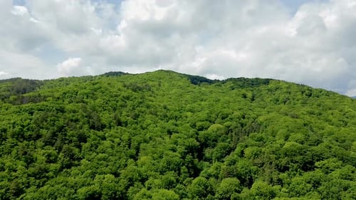 4k cinematic aerial drone stock footage flying over a beautiful mountain in a valley located in Roma
