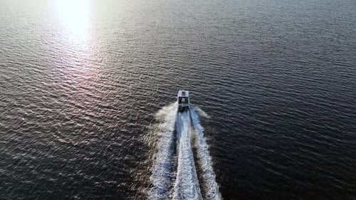 speedboat going on the sea on a sunny day