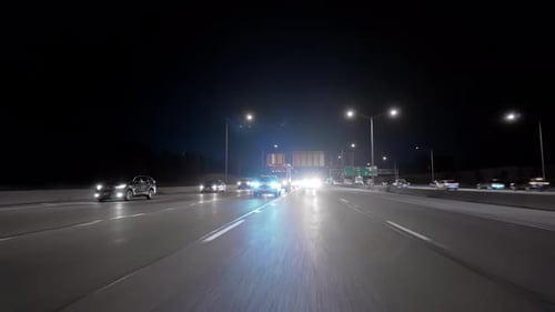 Wide Rear POV View Driving on Highway at Night Time Shot From the Car Inside