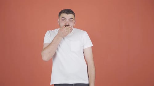 Man Reacts with Shock and Surprise