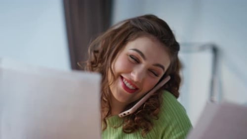 Smiling Woman Chatting on Her Mobile Phone