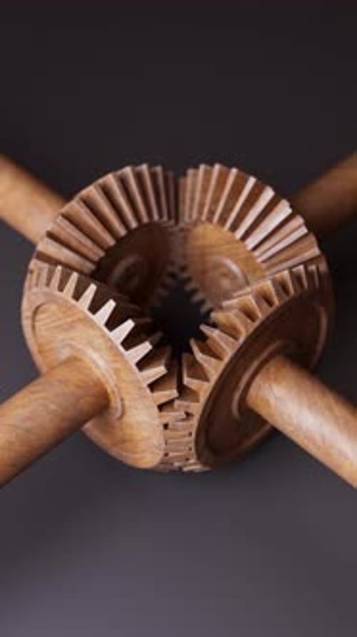 Looping animation of a mechanical construction made of wooden gears.