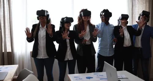 Multiracial Teamwork Having Fun Wearing Virtual Reality Headset Inside Business Office