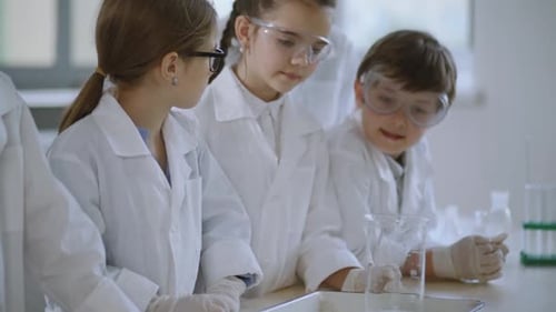 Young Children Conducting Science Experiments in a Lab