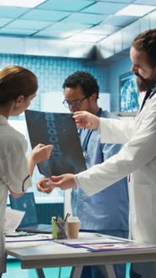 Vertical Video Doctors Analyze Human Anatomy Scans in a Treatment Center
