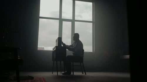 Man Adjusting Classic Television Indoors