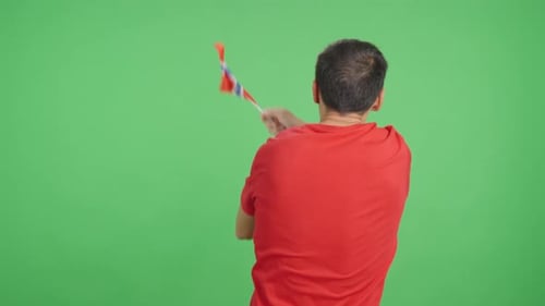 Rear View of a Man Waving a Norwegian Pennant