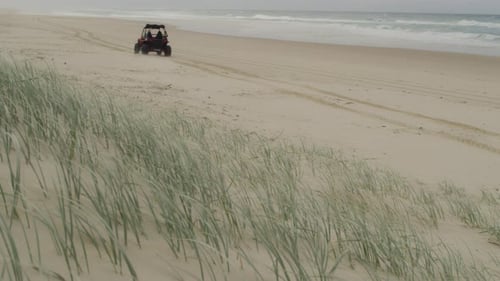 Atv adventure on a remote australian beach paradise with azure ocean views