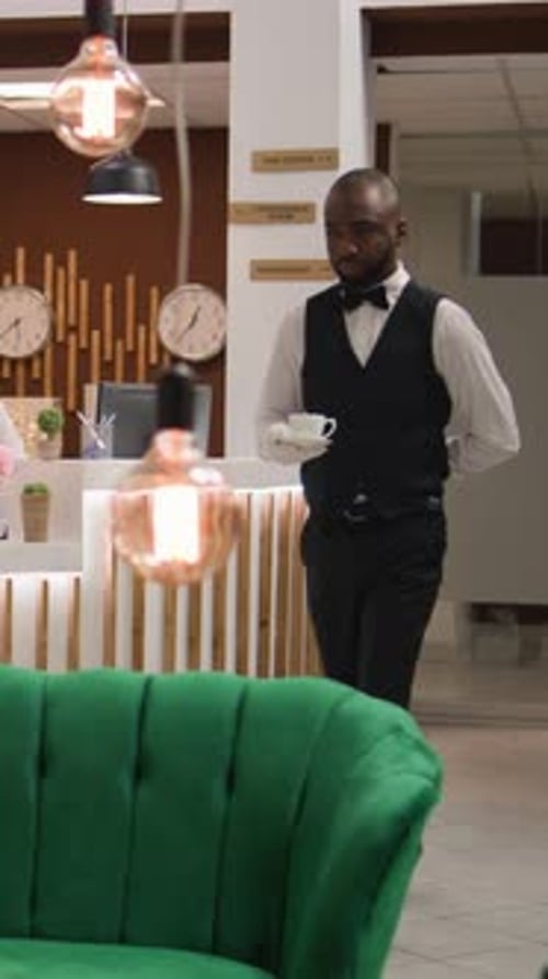 Stylish Hotel Lobby with Staff and Businessman