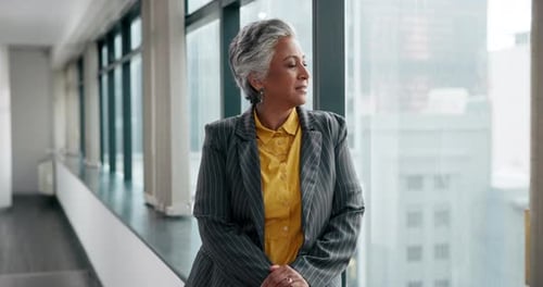 Stylish Woman in Modern Office Leans on Window