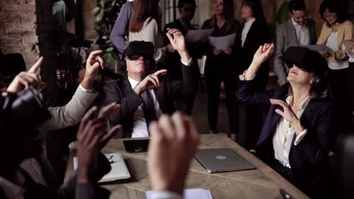Multiracial business people wearing virtual reality futuristic goggles inside office