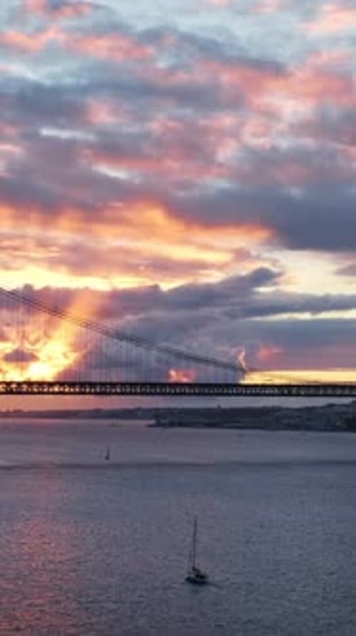 View of 25 De Abril Bridge Famous Tourist Landmark of Lisbon in Evening Twilight Lisbon Portugal