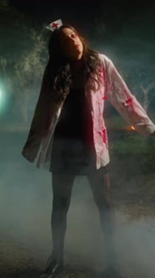 Zombie Woman Moves In Forest On Foggy Halloween Night