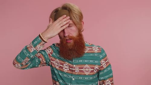 Man Coughing and Holding Head in Discomfort